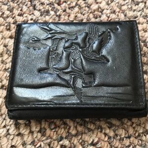 Leather wallet with flying duck design